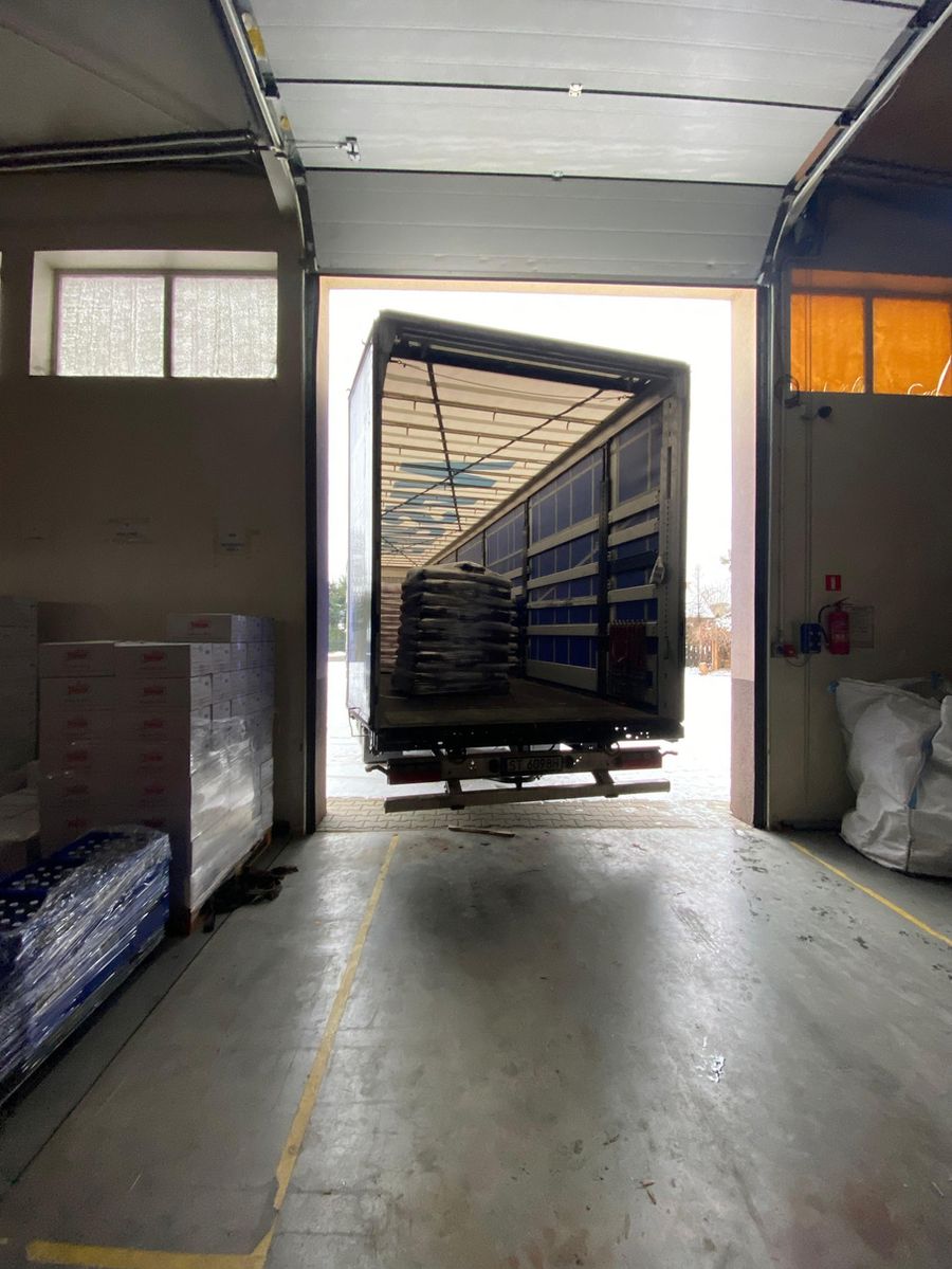 Forklift loading pallets into a trailer